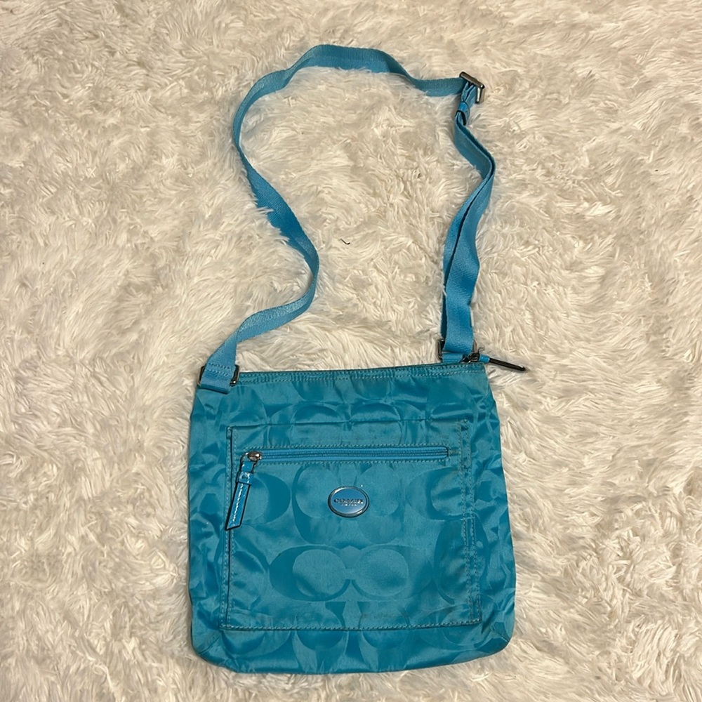 Blue cross body Coach purse